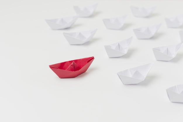 origami boats representing leadership concept 23 2148148313